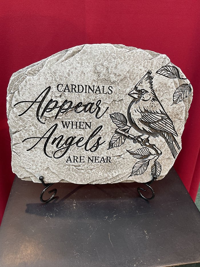 Cardinals appear garden stone
